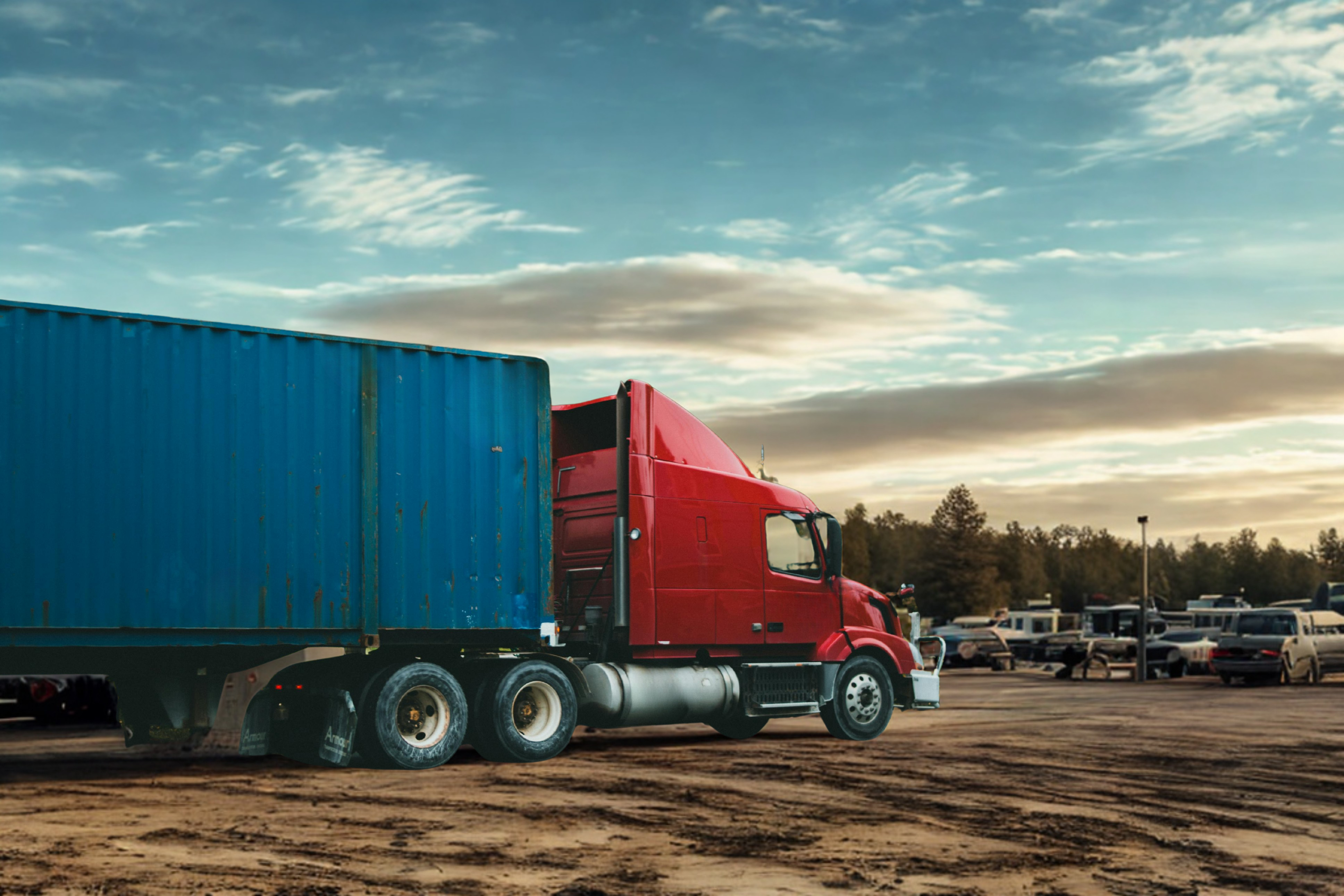 A truck on a highway at sunset